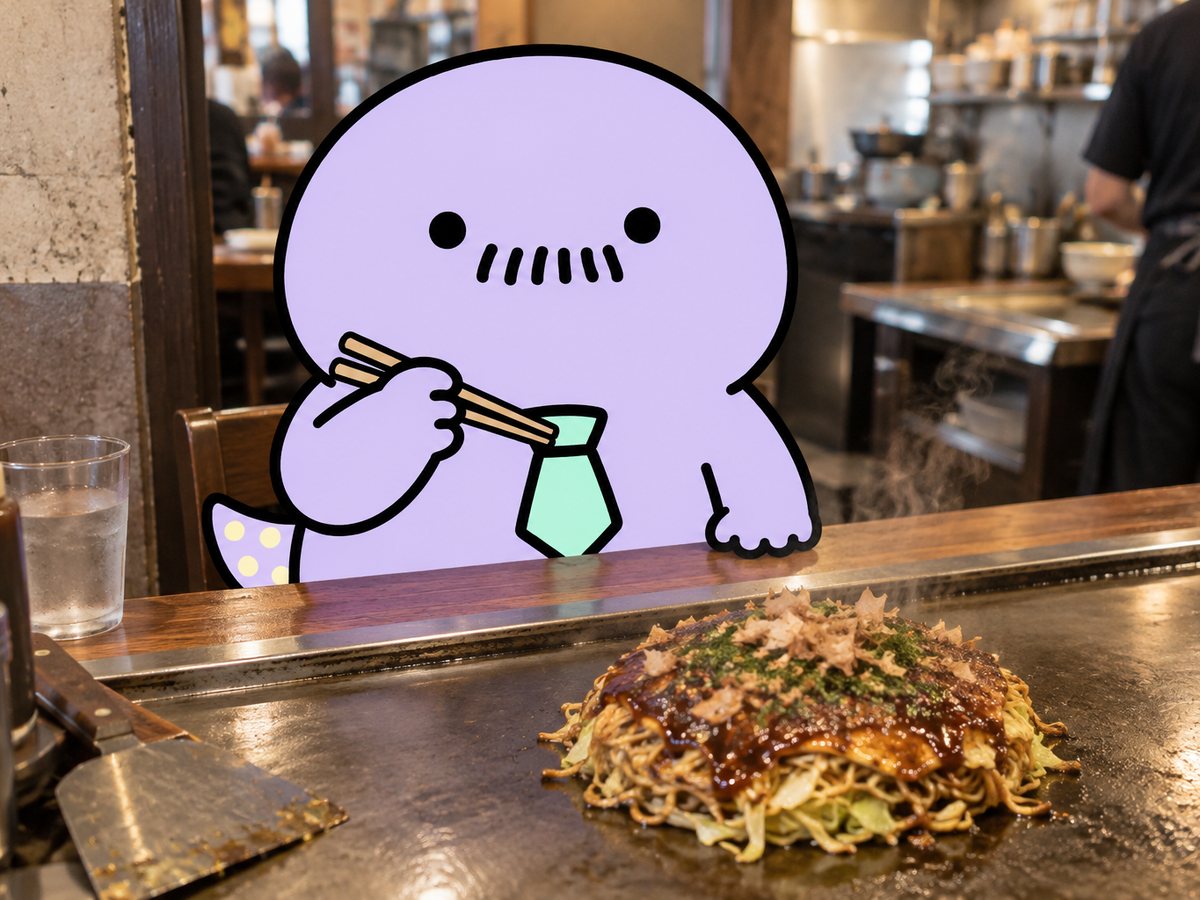 作例：お好み焼き屋のカウンターでお箸を構えるハンザキさん（写真合成）